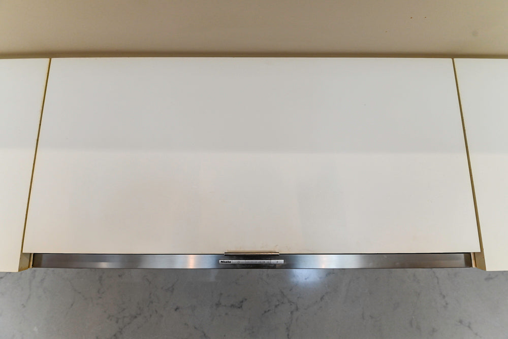 Modern Matte White Kitchen with Waterfall Island, Quartz Countertops & Miele Appliances