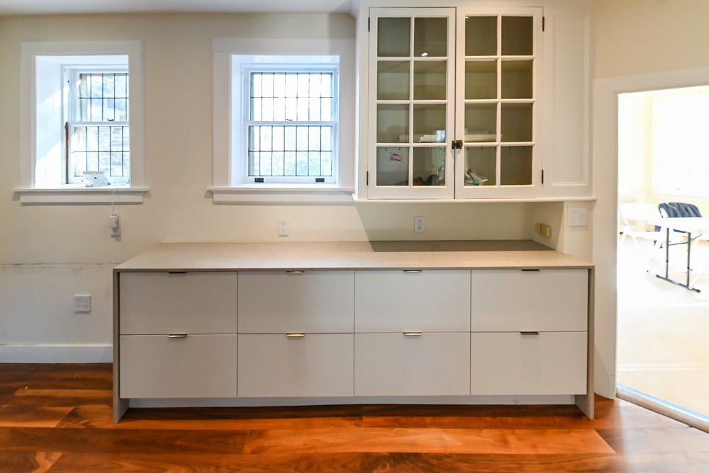 Modern Matte White Kitchen with Waterfall Island, Quartz Countertops & Miele Appliances