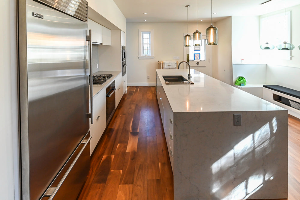 Modern Matte White Kitchen with Waterfall Island, Quartz Countertops & Miele Appliances