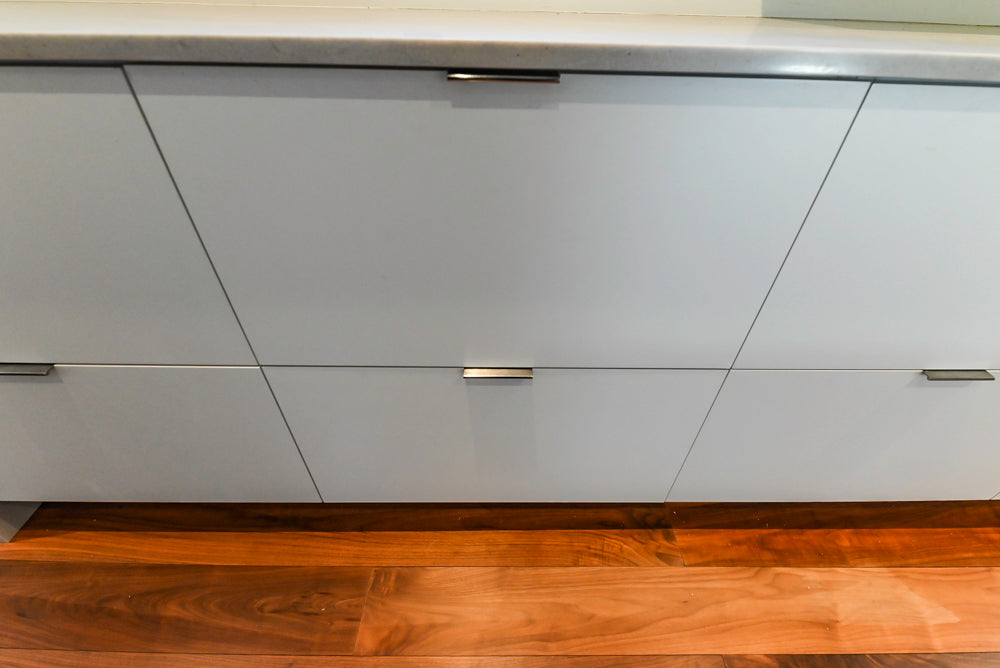 Modern Matte White Kitchen with Waterfall Island, Quartz Countertops & Miele Appliances