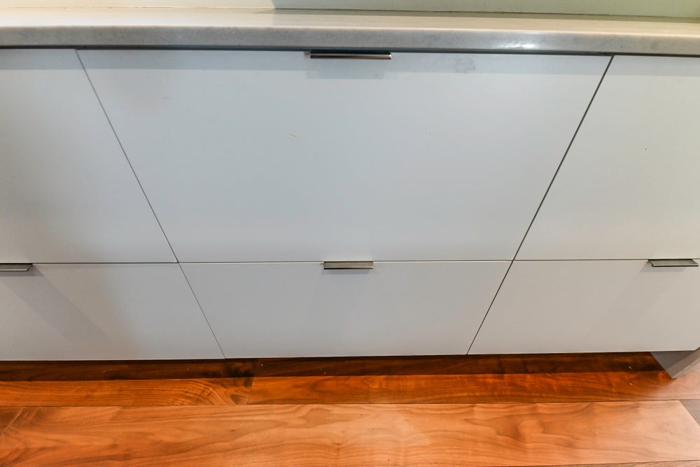 Modern Matte White Kitchen with Waterfall Island, Quartz Countertops & Miele Appliances