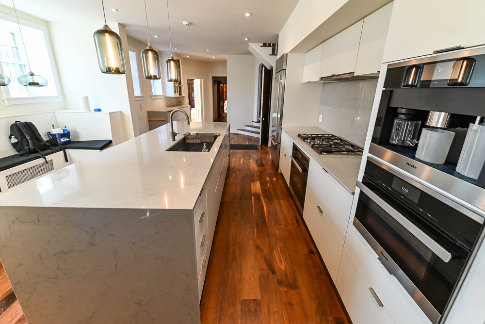 Modern Matte White Kitchen with Waterfall Island, Quartz Countertops & Miele Appliances