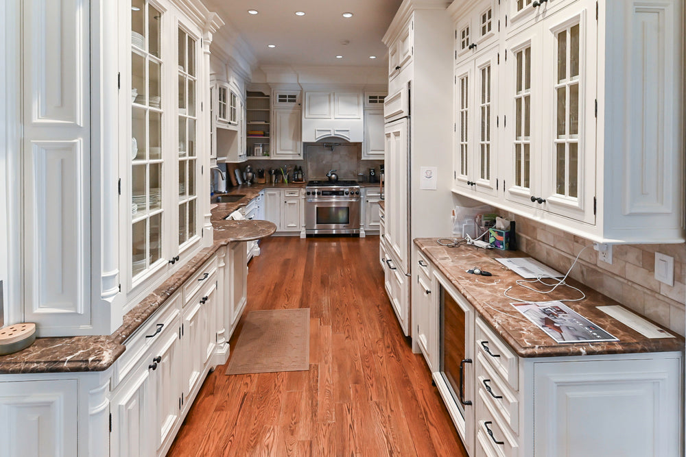 Quakermaid Traditional White Kitchen with Marble Countertops and Luxe Appliances