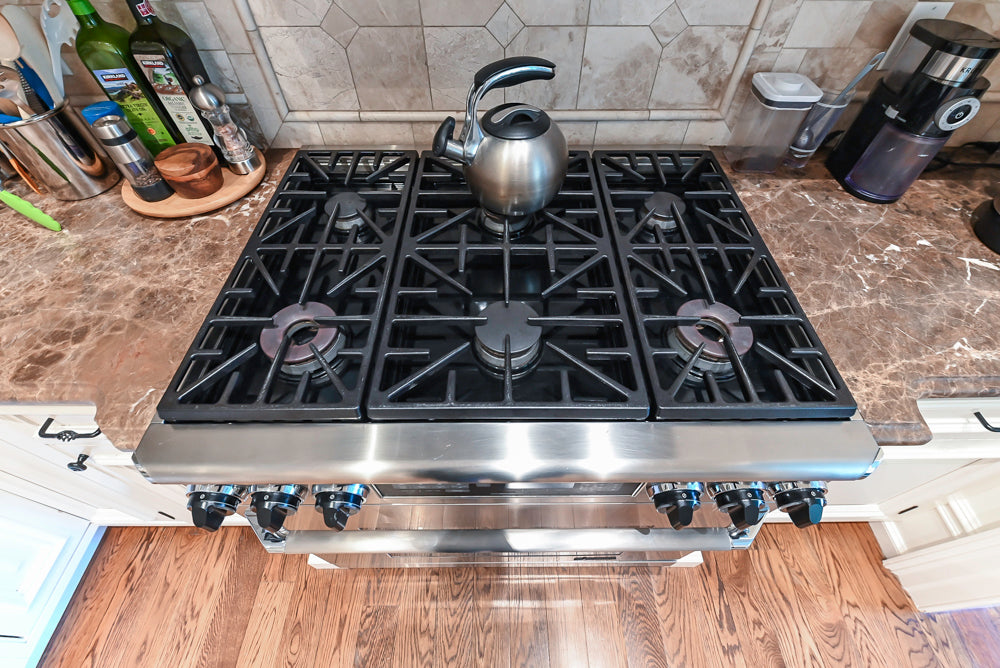 Quakermaid Traditional White Kitchen with Marble Countertops and Luxe Appliances
