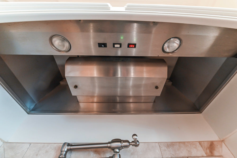 Quakermaid Traditional White Kitchen with Marble Countertops and Luxe Appliances