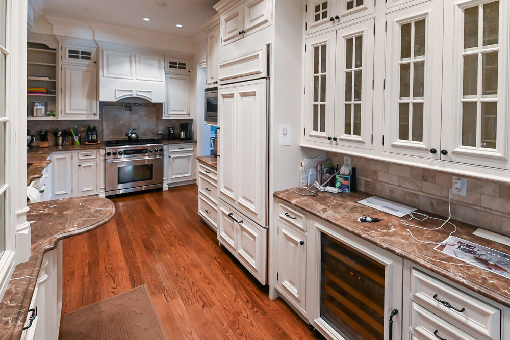 Quakermaid Traditional White Kitchen with Marble Countertops and Luxe Appliances