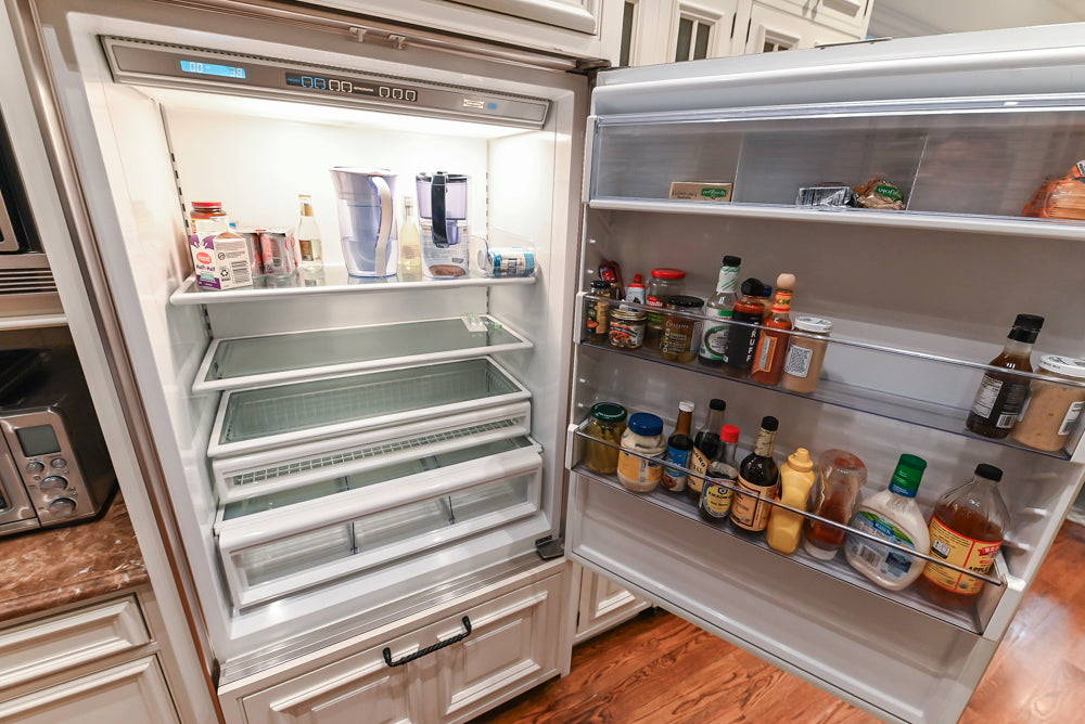 Quakermaid Traditional White Kitchen with Marble Countertops and Luxe Appliances