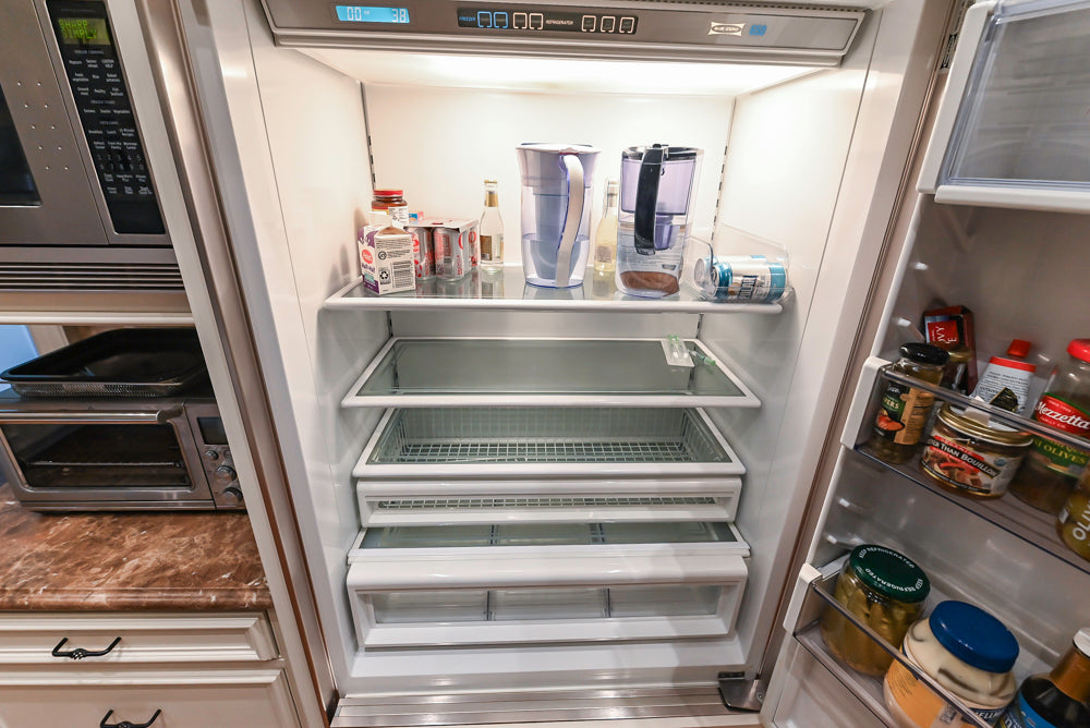 Quakermaid Traditional White Kitchen with Marble Countertops and Luxe Appliances