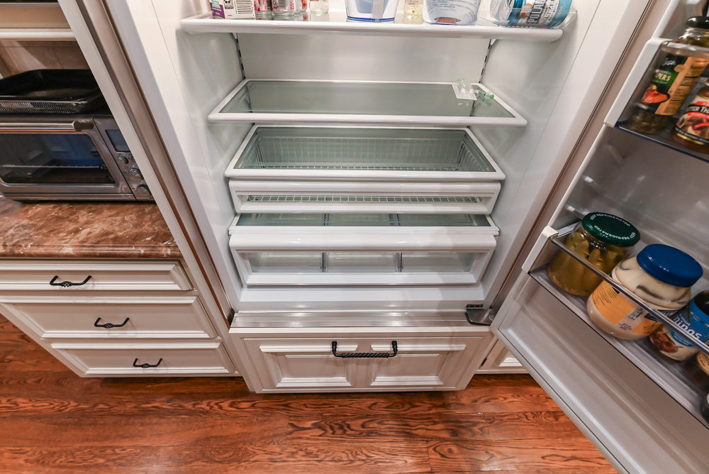 Quakermaid Traditional White Kitchen with Marble Countertops and Luxe Appliances