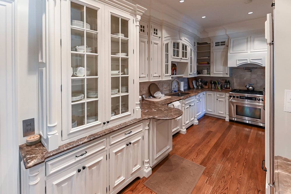 Quakermaid Traditional White Kitchen with Marble Countertops and Luxe Appliances