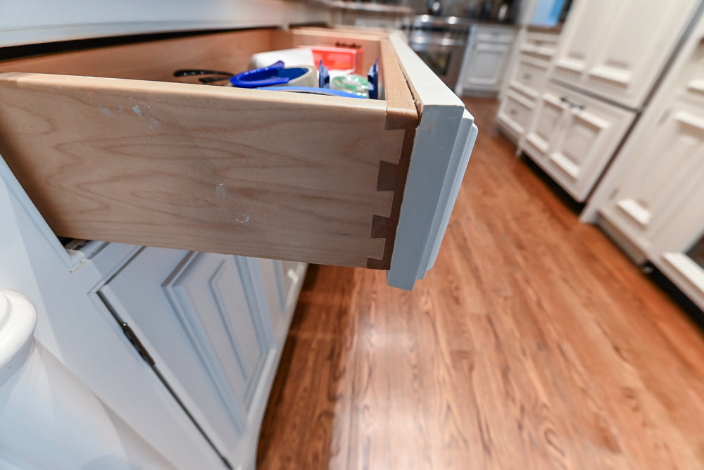 Quakermaid Traditional White Kitchen with Marble Countertops and Luxe Appliances
