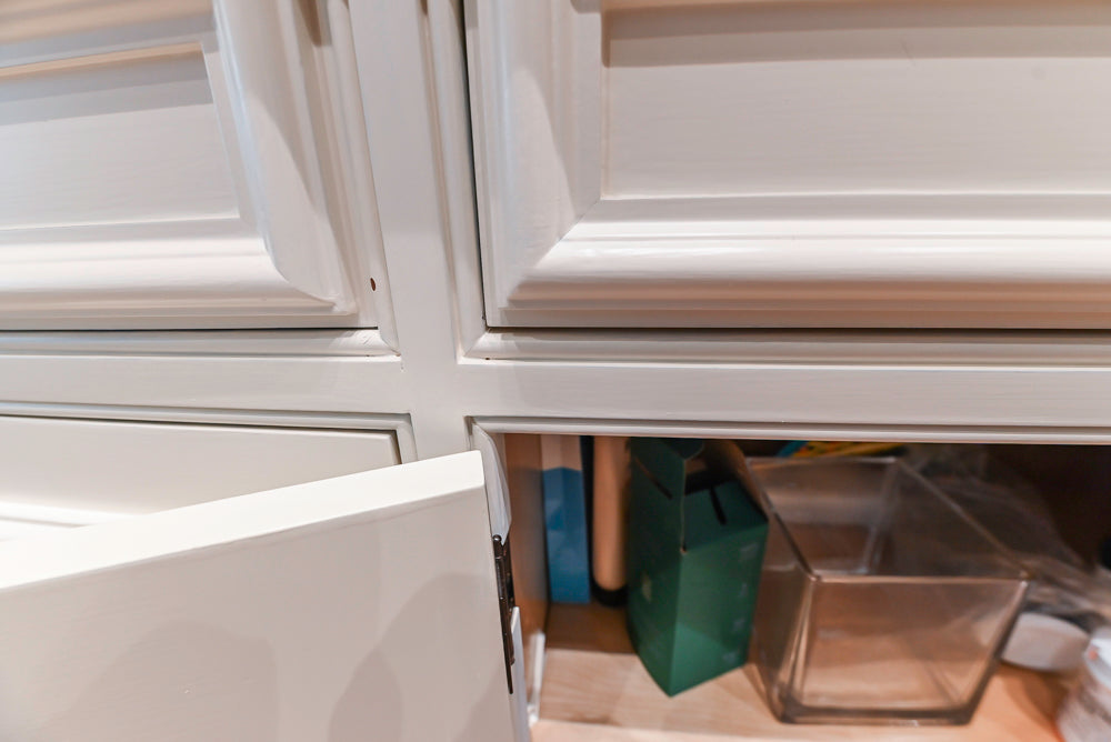 Quakermaid Traditional White Kitchen with Marble Countertops and Luxe Appliances