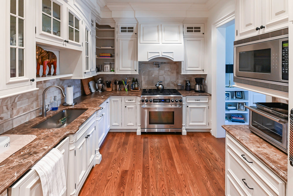 Quakermaid Traditional White Kitchen with Marble Countertops and Luxe Appliances