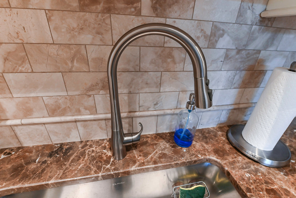 Quakermaid Traditional White Kitchen with Marble Countertops and Luxe Appliances