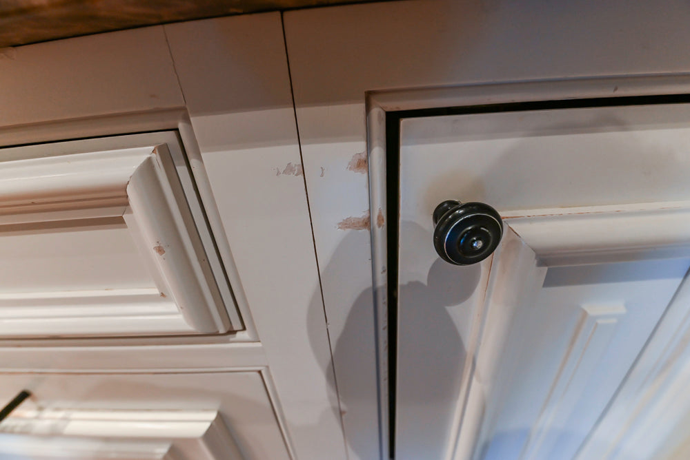 Quakermaid Traditional White Kitchen with Marble Countertops and Luxe Appliances