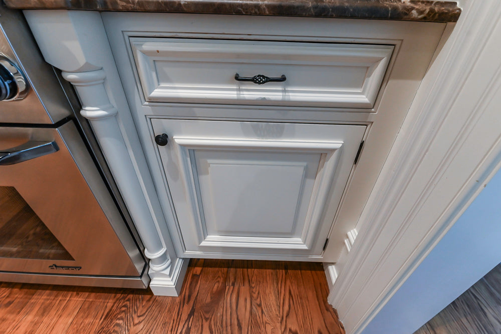Quakermaid Traditional White Kitchen with Marble Countertops and Luxe Appliances
