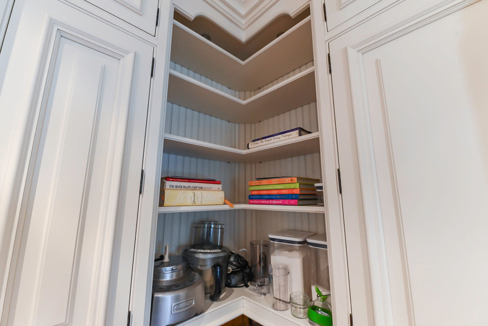 Quakermaid Traditional White Kitchen with Marble Countertops and Luxe Appliances