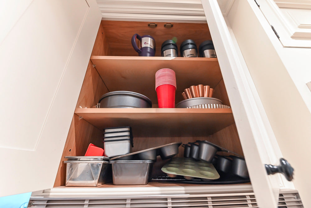 Quakermaid Traditional White Kitchen with Marble Countertops and Luxe Appliances