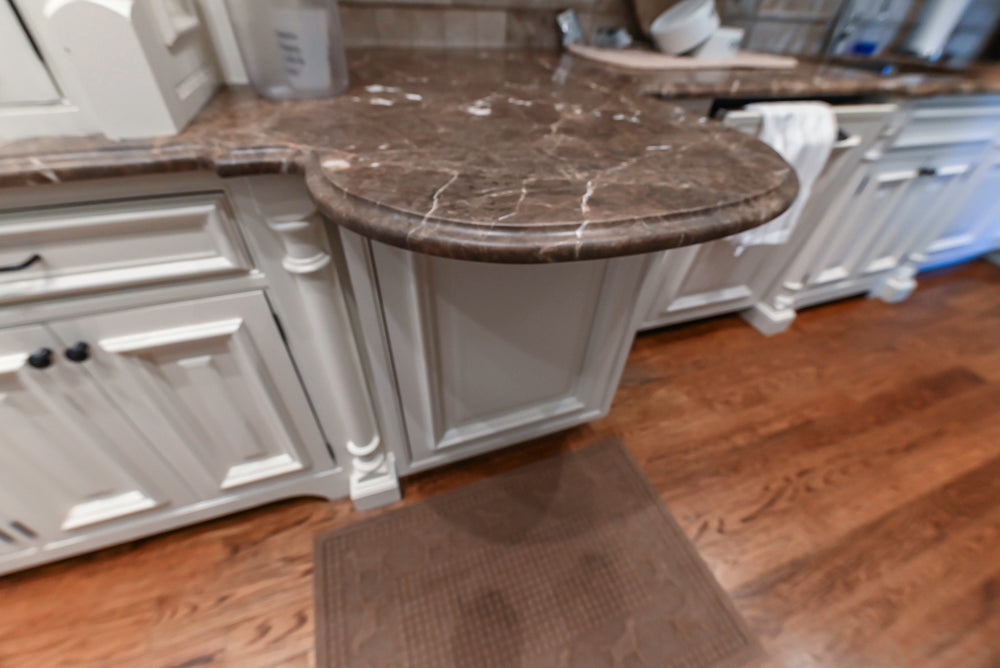 Quakermaid Traditional White Kitchen with Marble Countertops and Luxe Appliances