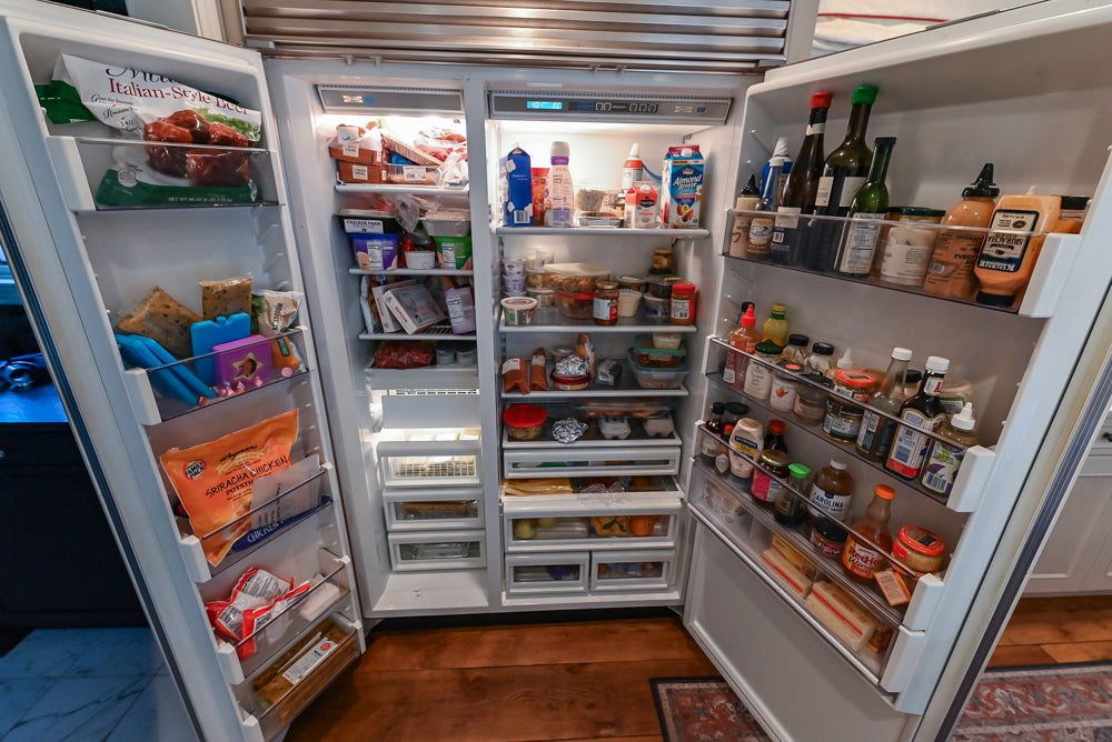 Wood-Mode Traditional Light Cream Kitchen with Marble Countertops and Wolf Range