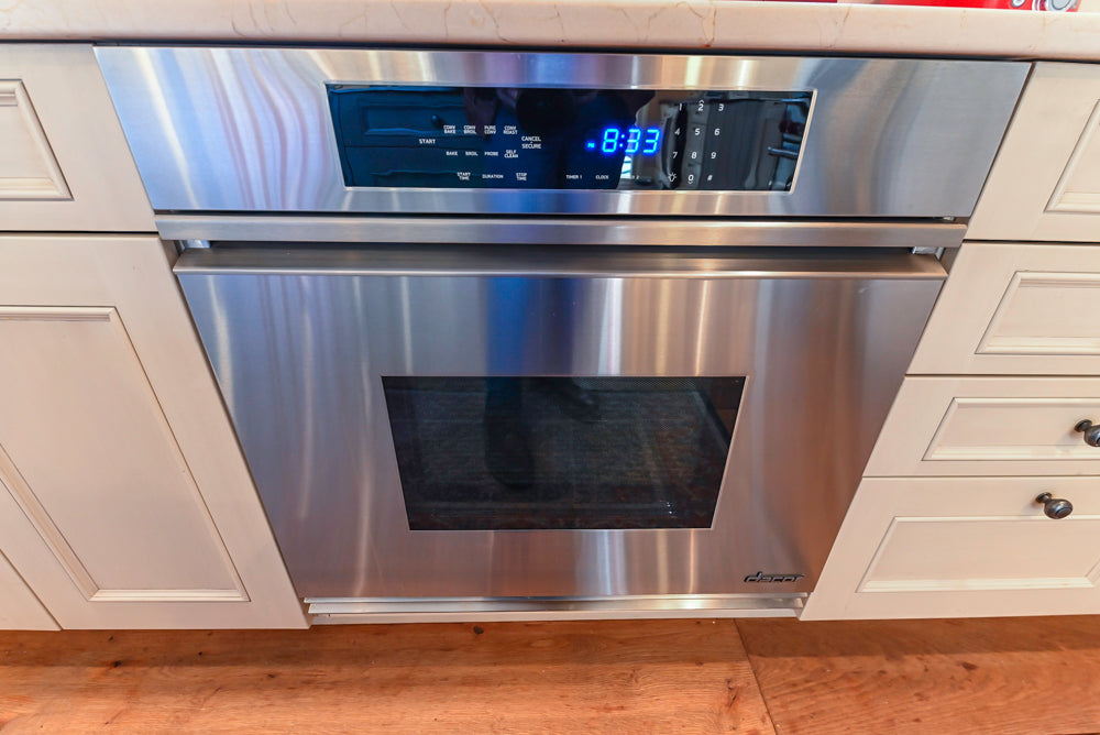 Wood-Mode Traditional Light Cream Kitchen with Marble Countertops and Wolf Range
