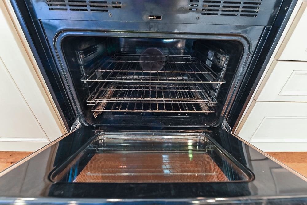 Wood-Mode Traditional Light Cream Kitchen with Marble Countertops and Wolf Range