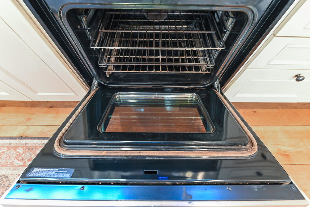 Wood-Mode Traditional Light Cream Kitchen with Marble Countertops and Wolf Range