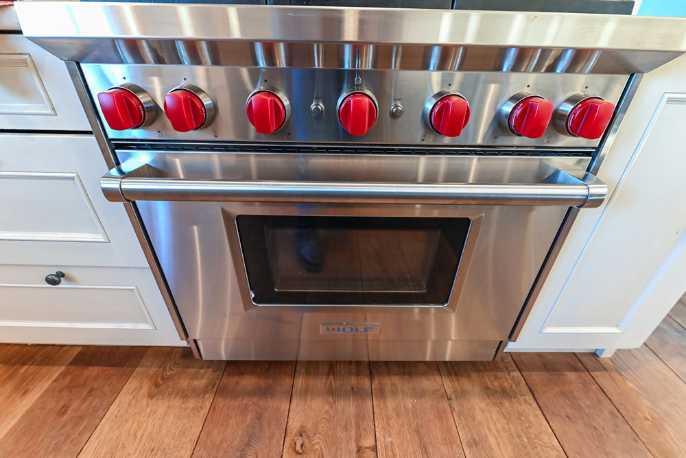 Wood-Mode Traditional Light Cream Kitchen with Marble Countertops and Wolf Range