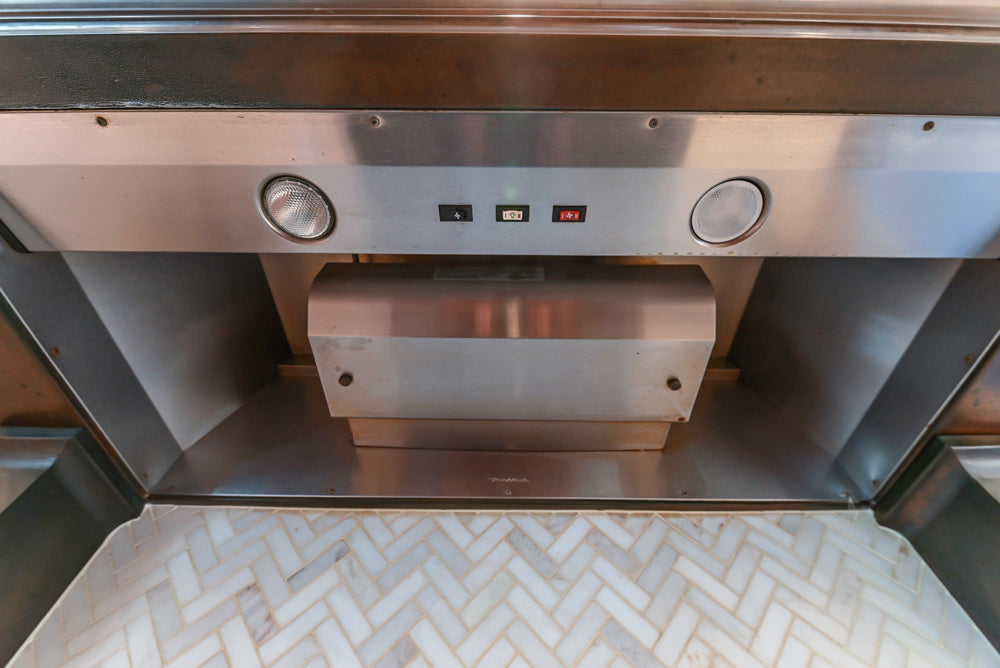 Wood-Mode Traditional Light Cream Kitchen with Marble Countertops and Wolf Range