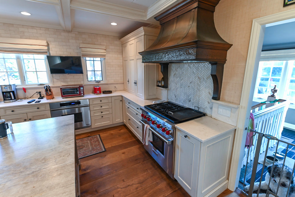 Wood-Mode Traditional Light Cream Kitchen with Marble Countertops and Wolf Range