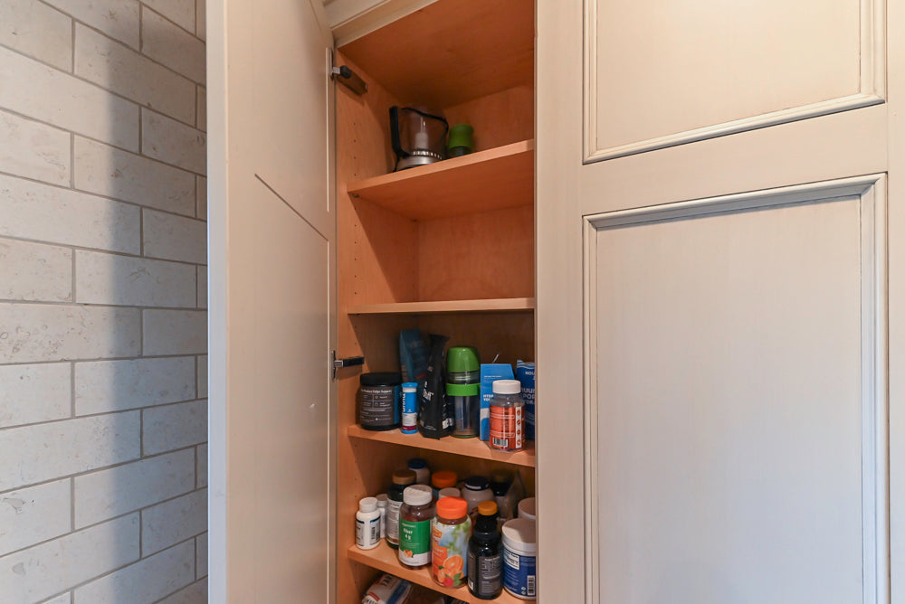 Wood-Mode Traditional Light Cream Kitchen with Marble Countertops and Wolf Range