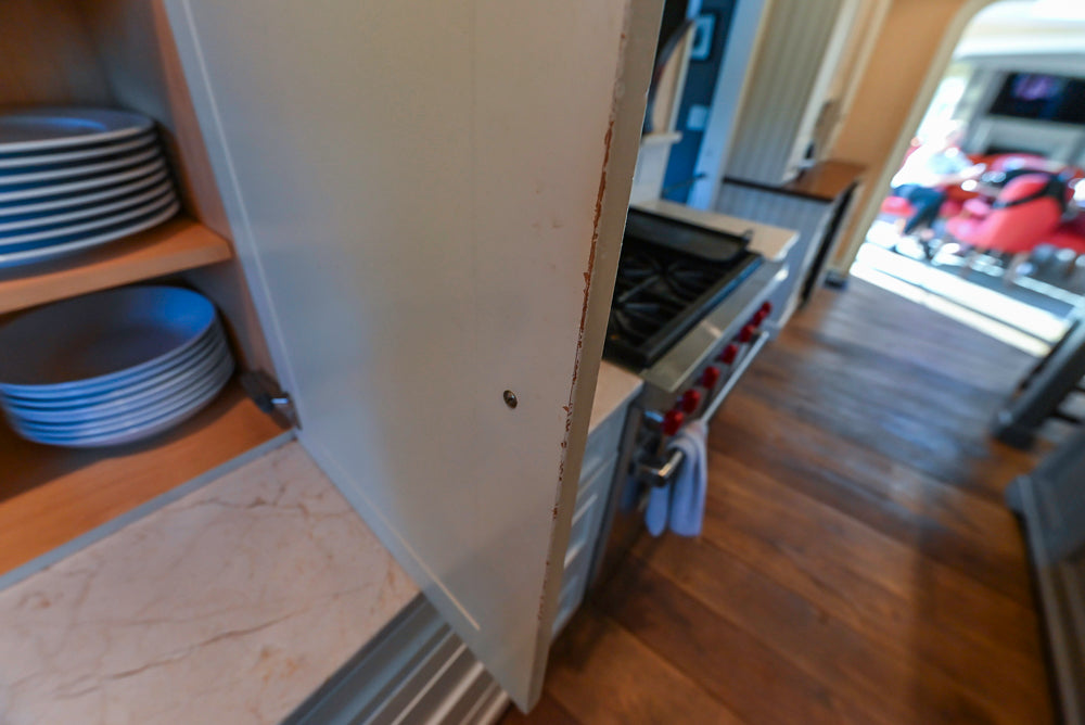 Wood-Mode Traditional Light Cream Kitchen with Marble Countertops and Wolf Range