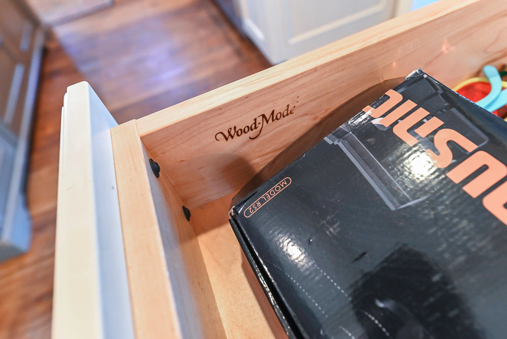 Wood-Mode Traditional Light Cream Kitchen with Marble Countertops and Wolf Range