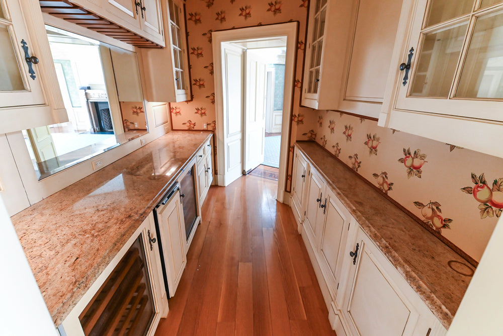 Christopher Peacock Traditional Cream Butler's Pantry with Granite Countertops & Sub-Zero Wine Coolers