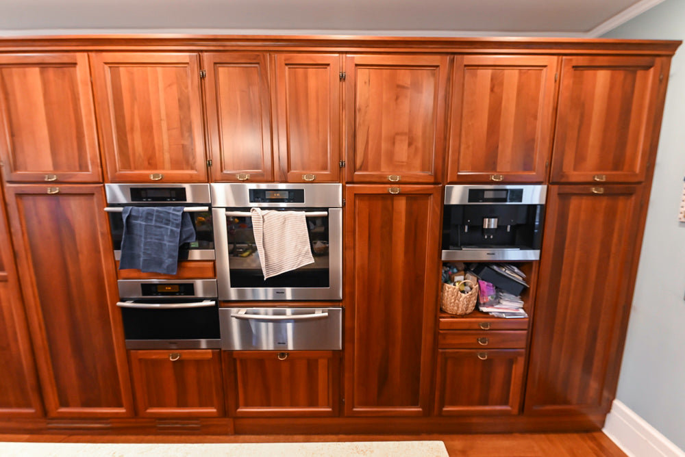Transitional Wooden Kitchen with Island, Stone Countertops and Miele Appliances