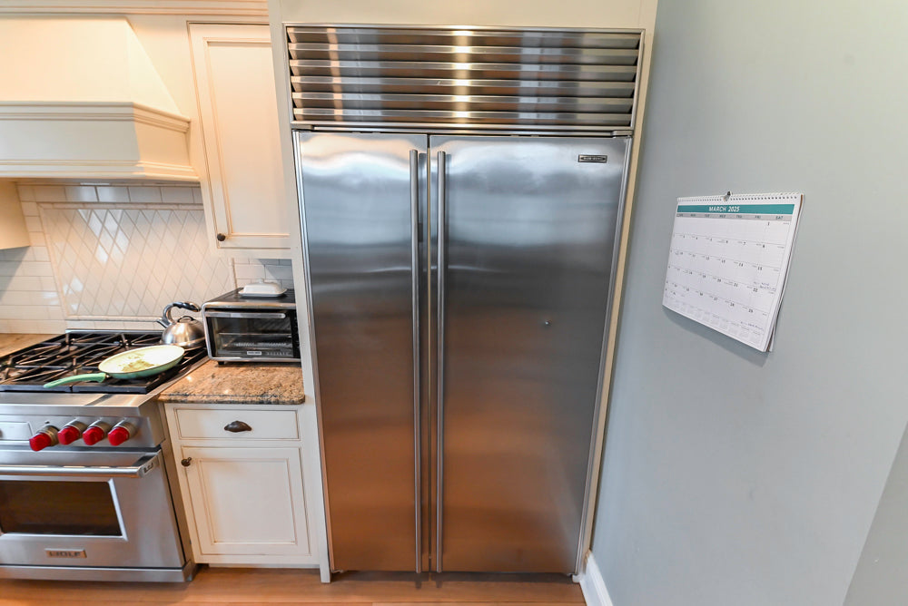 Omega Traditional Light Cream Kitchen with Island, Desk Area and Sub-Zero & Wolf Range