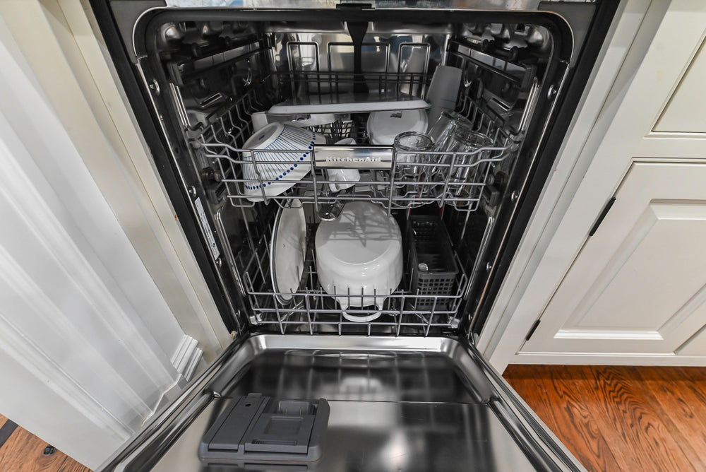 Traditional Creamy White Kitchen with Island, Marble Countertops and Appliances