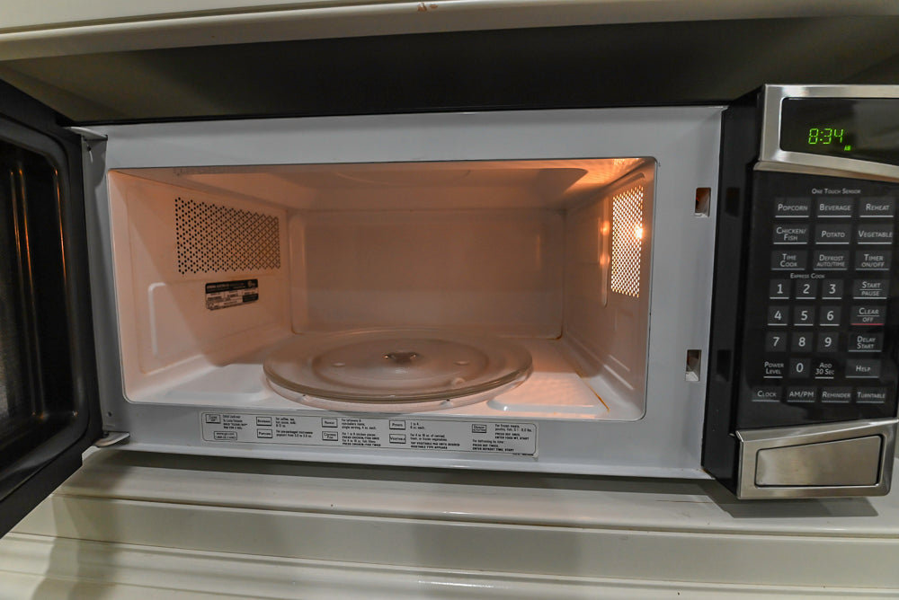 Traditional Creamy White Kitchen with Island, Marble Countertops and Appliances