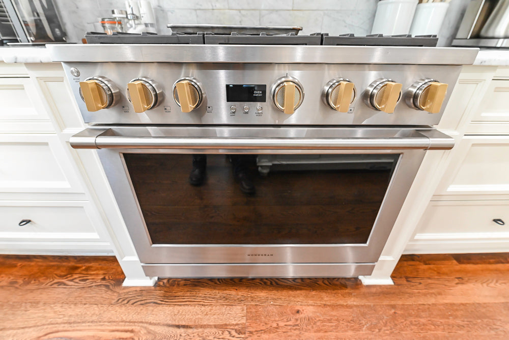 Traditional Creamy White Kitchen with Island, Marble Countertops and Appliances