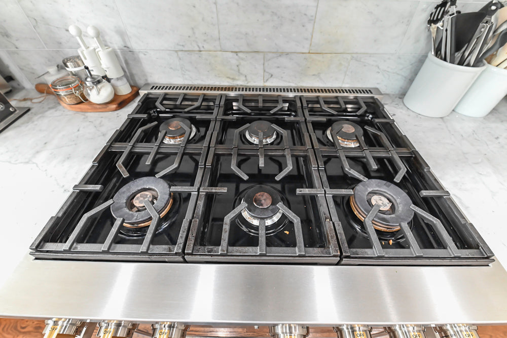 Traditional Creamy White Kitchen with Island, Marble Countertops and Appliances