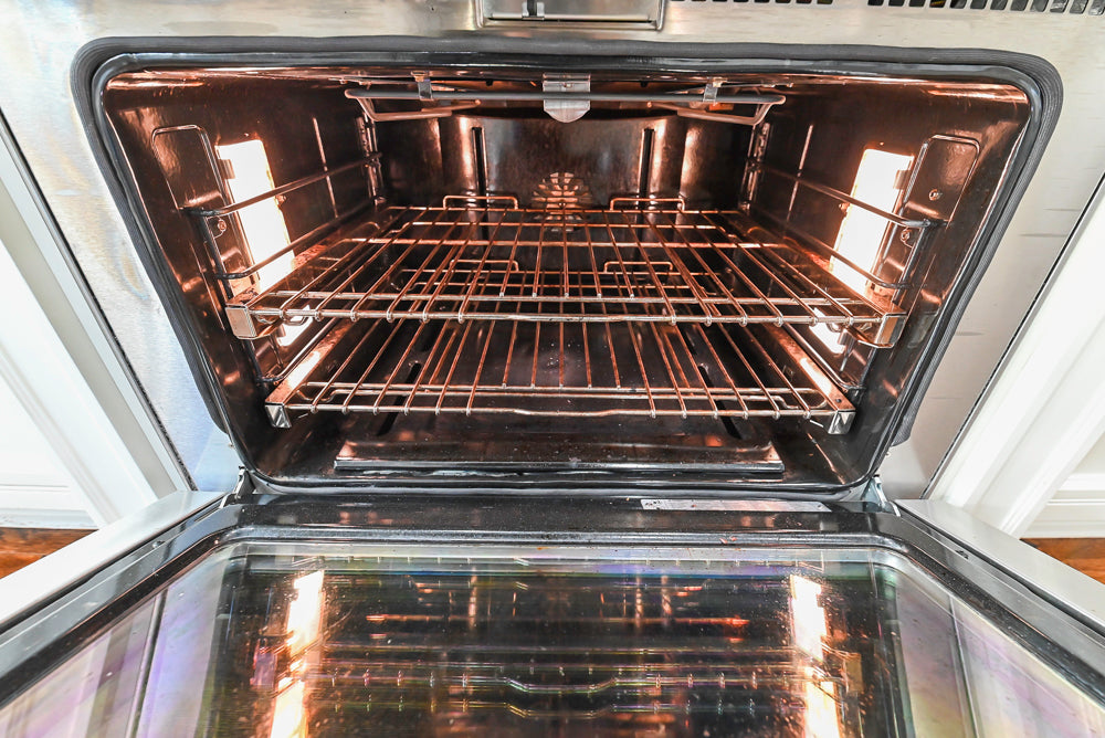 Traditional Creamy White Kitchen with Island, Marble Countertops and Appliances