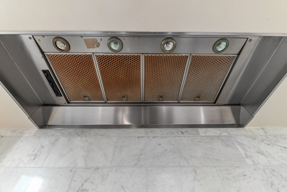 Traditional Creamy White Kitchen with Island, Marble Countertops and Appliances