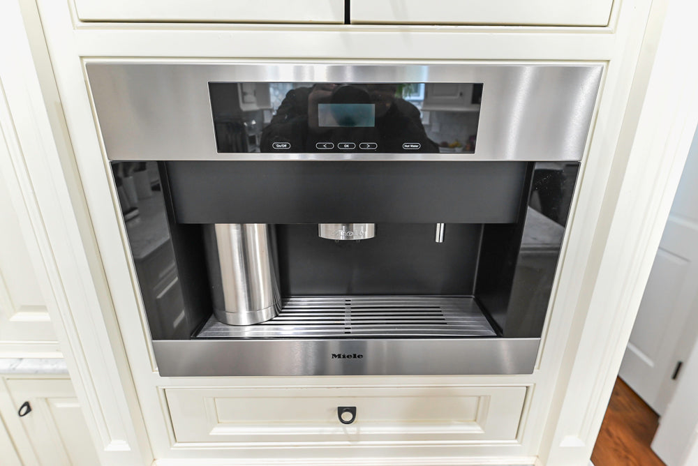 Traditional Creamy White Kitchen with Island, Marble Countertops and Appliances