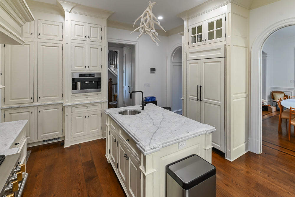 Traditional Creamy White Kitchen with Island, Marble Countertops and Appliances