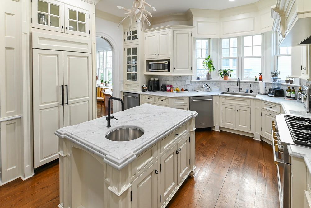 Traditional Creamy White Kitchen with Island, Marble Countertops and Appliances