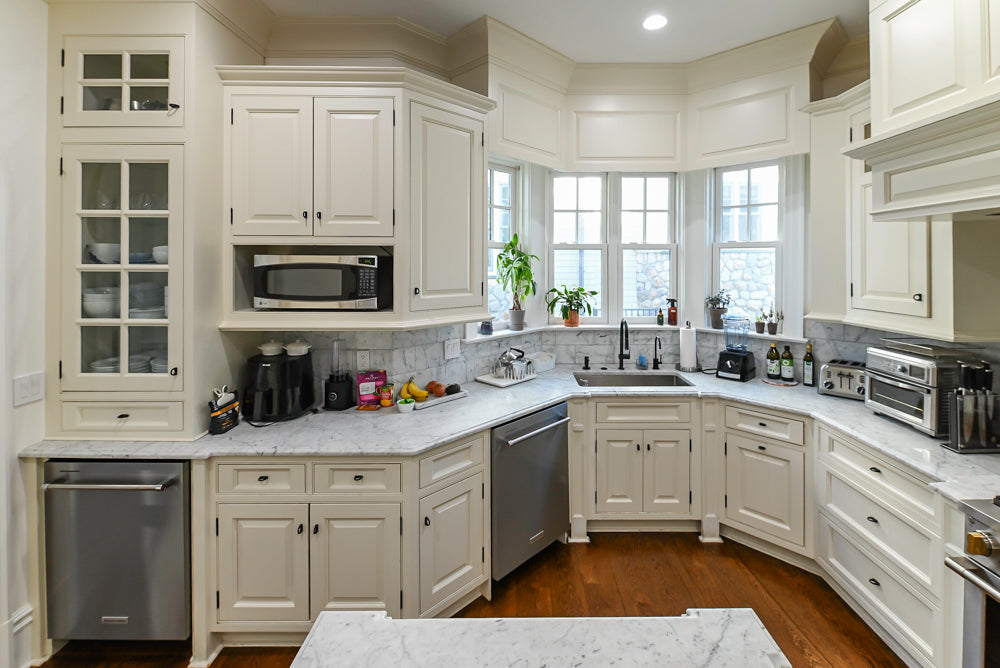 Traditional Creamy White Kitchen with Island, Marble Countertops and Appliances