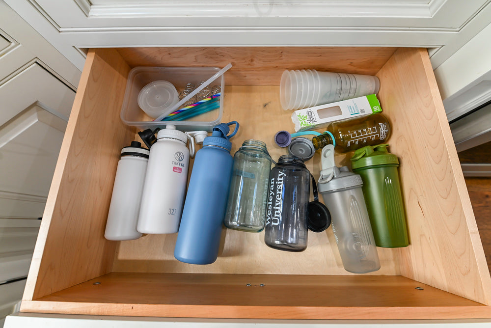 Traditional Creamy White Kitchen with Island, Marble Countertops and Appliances