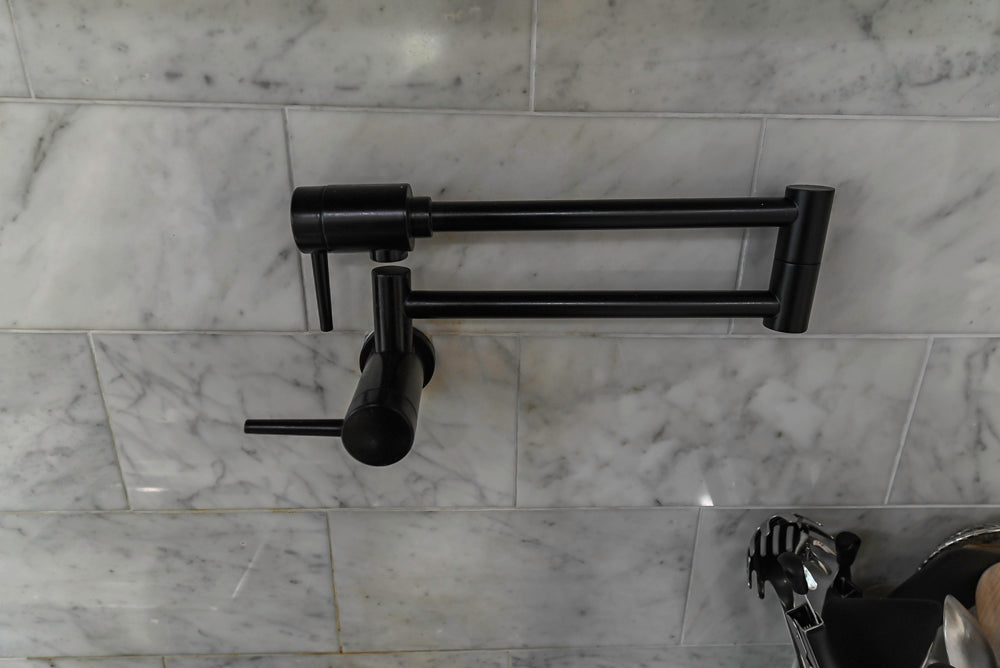 Traditional Creamy White Kitchen with Island, Marble Countertops and Appliances