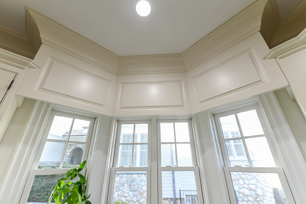 Traditional Creamy White Kitchen with Island, Marble Countertops and Appliances