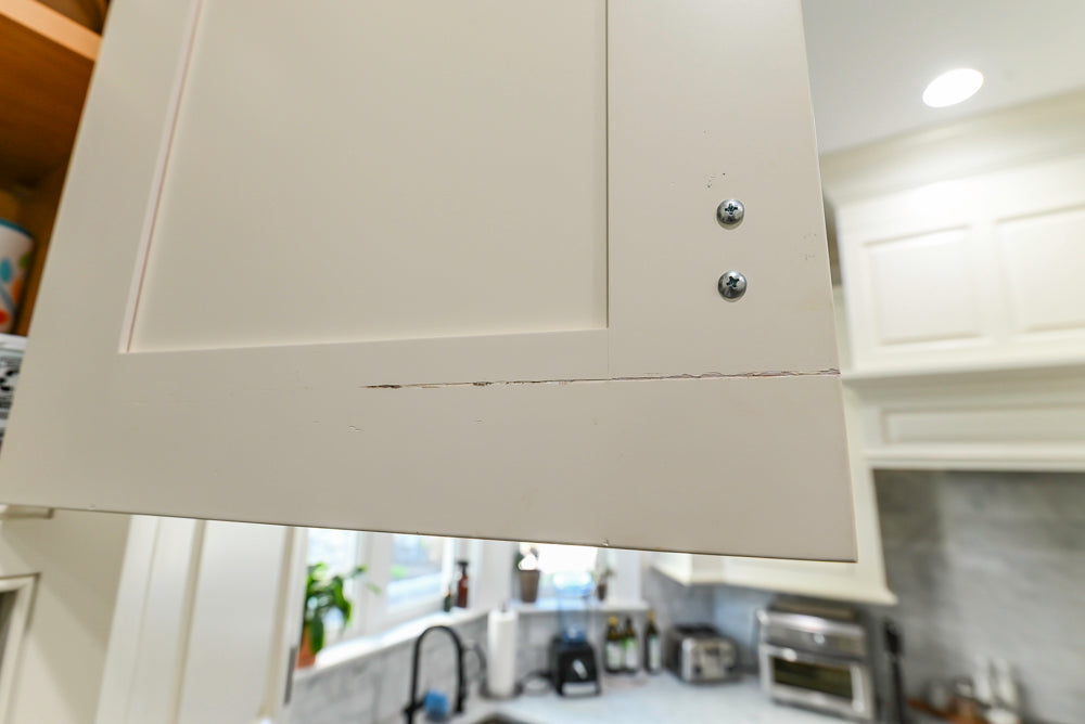 Traditional Creamy White Kitchen with Island, Marble Countertops and Appliances